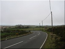 SH4490 : Bend in B5111 as it reaches lower land north of Mynydd Parys by Eric Jones