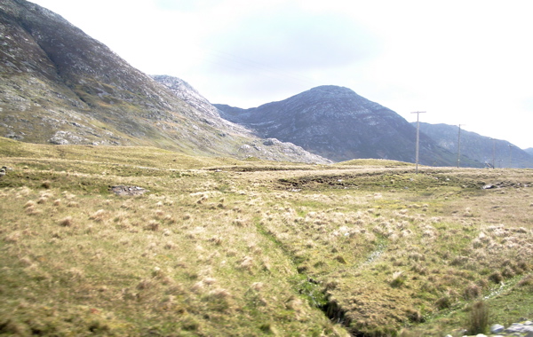 Grassland between Lough Inagh and the Maumturks