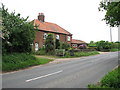 Farm cottages and honesty stall on Holt Road