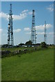 SO9924 : Masts on Cleeve Hill by Philip Halling