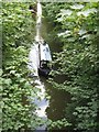 Narrowboat approaching Marshcroft Bridge (No 134) on the Grand Union Canal