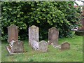 Three gravestones in a row at St. Andrews Church Colne Engaine