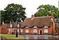 Thatched cat on cottage roof, Dunchurch