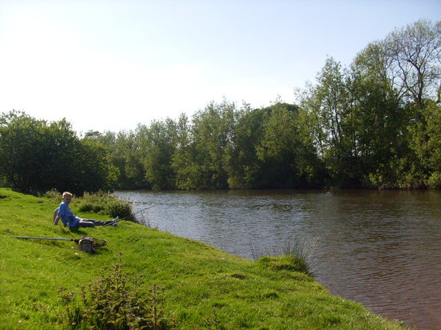 A lad fishing on the Severn, Caersws, Powys