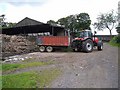 NY9987 : Tractor at Catcherside by Oliver Dixon