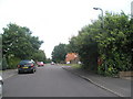 Partially hidden postbox in Corby Drive