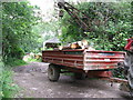 Trailer on tractor in timber yard at Ansty