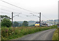 NU2312 : Lane beside railway near Lesbury by Andy F