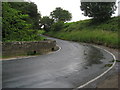 Damp road at Clough Hollow