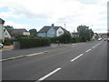 Approaching the junction of The Crossways and Mill Pond Road