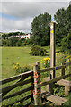 A stile and marker post on the St Cuthbert