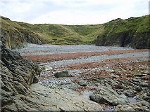 SH2987 : The exposed shingle beach at Porth Fudr by Eric Jones