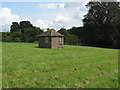 TQ3730 : Brick building in middle of field next to Tanyard by Dave Spicer