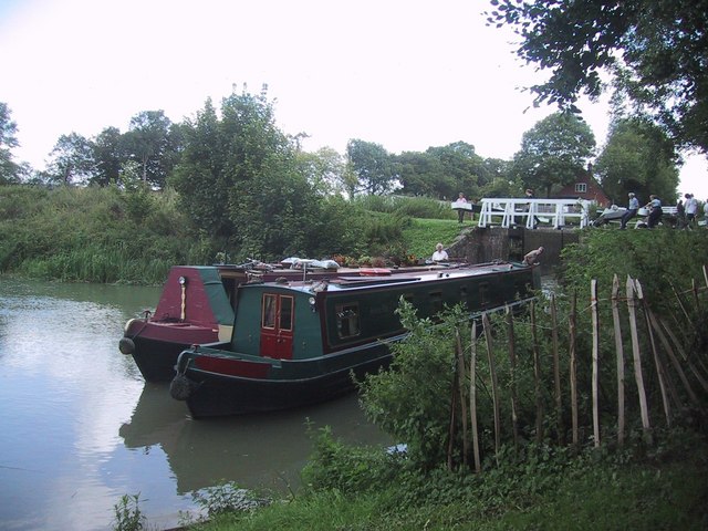 Narrow boats leave an upper lock at the top of the Caen Hill flight