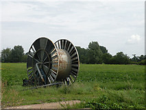 TL5167 : Giant cotton reel beside Long Drove by Keith Edkins