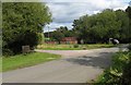 Seat at junction of footpaths and country lane