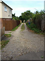 Unmade road in housing estate, northern Bury St. Edmunds