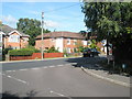 Looking out from Chase Farm Close onto the B2177