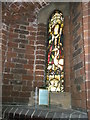 Stained glass window on the north wall at St Peter