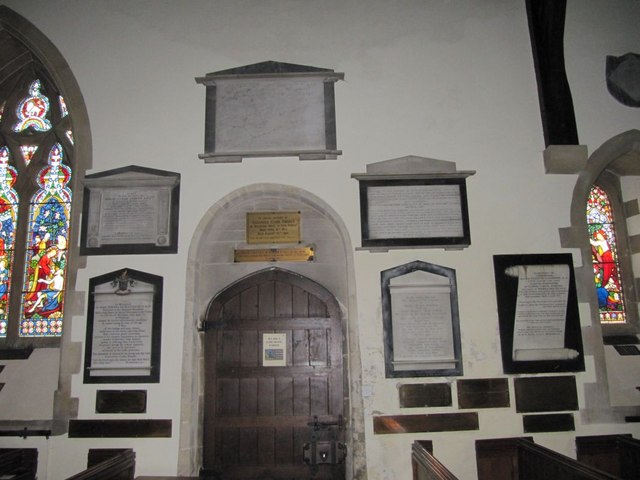 Memorials round the doorway