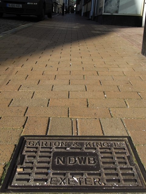 An inspection cover with the inscription Garton & King, Exeter & NDWB