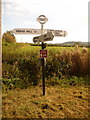 ST8427 : Motcombe: North End Cross signpost by Chris Downer