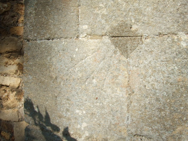 Close up of mass dial on buttress of St. James church