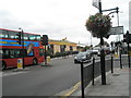 Bus passing the crossroads by the Gurdwara