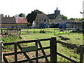 Home Farm and the church from NW