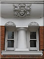 TQ2881 : Smirking face above a window in Treborough House, Nottingham Place / Paddington Street, W1 by Mike Quinn