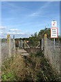 TQ3715 : Railway Crossing near Wootton Farm by Simon Carey
