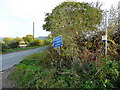 Signs at the foot of Gretton Hill