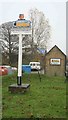 TG0433 : Village sign by roger geach