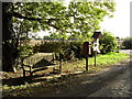 Bench, post box and notice board in Grafton