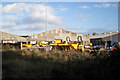 Dumper trucks behind Thwaites factory