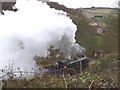 Steam train coming out of Mytholmes Tunnel