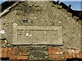 Plaque on building wall, Ballybracken