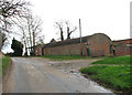 Hall Road past barns at Hall Farm