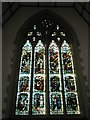 Stained glass window on the west wall at St Peter and St Paul, Godalming