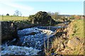 Weir for a pit.