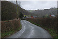 Road entering Llawr-y-glyn from the east