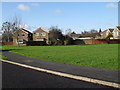 Looking across the green in Broadlands Avenue towards Buckland Close