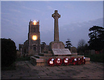 TM3698 : Holy Trinity church and war memorial at dusk by Evelyn Simak