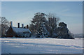 Snowy field towards Elmswell church