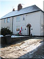 Seasonal figure outside a house in Roke Lane