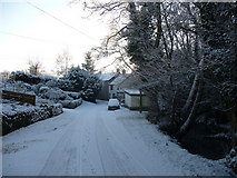 SO3474 : Snow dusted lane beside the River Redlake, Bucknell by Jeremy Bolwell