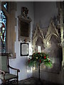 Floral display  by a stained glass window at St Mary, East Lavant