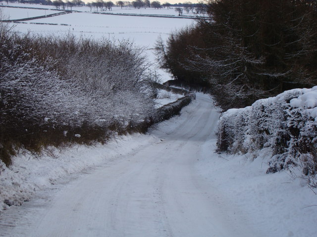 Snow covered country road