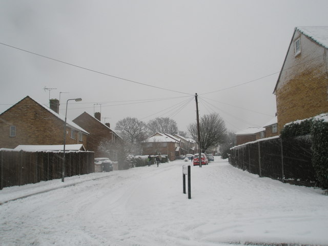 Looking from Hazleholt Drive into a snowy Burgate Close