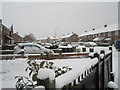 Looking across a snowy garden towards Blendworth Crescent